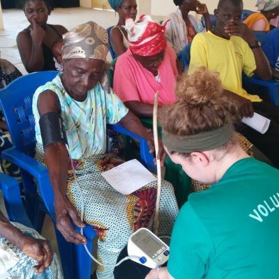 A Projects Abroad intern measures blood pressure on our Medicine placement for high school students in Ghana A teenager measures blood pressure during our medical internship in Ghana